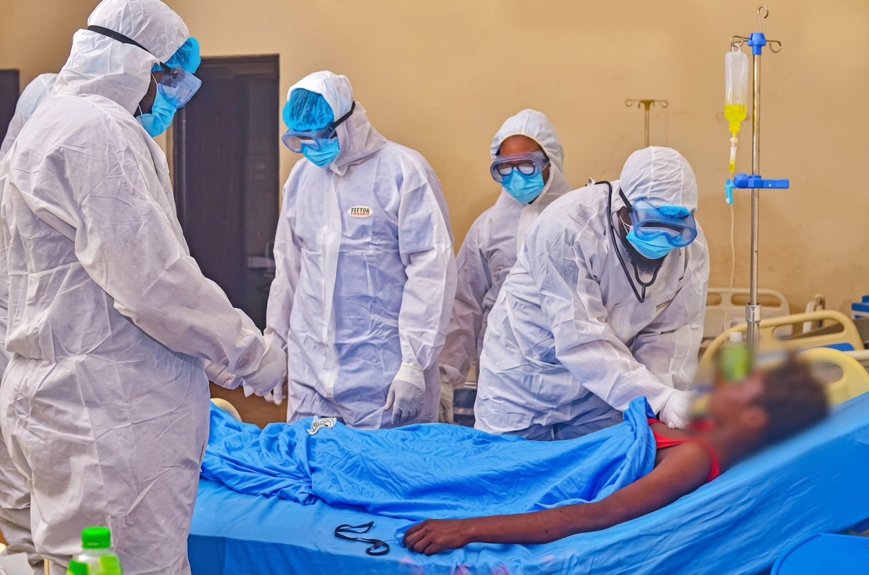 Bedside management of a patient on IV therapy in the isolation ward