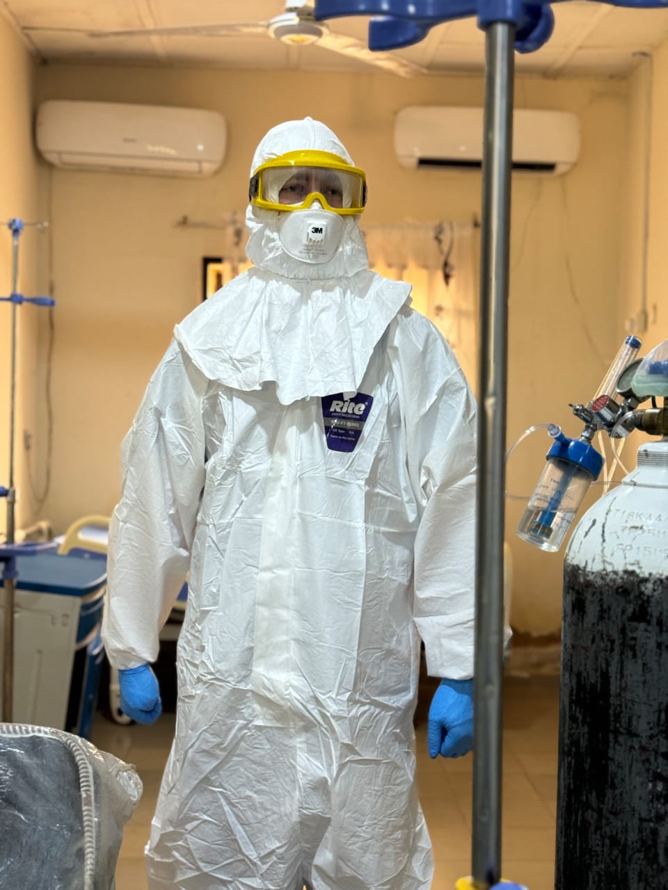 Frontline clinician fully donned in PPE before ward entry