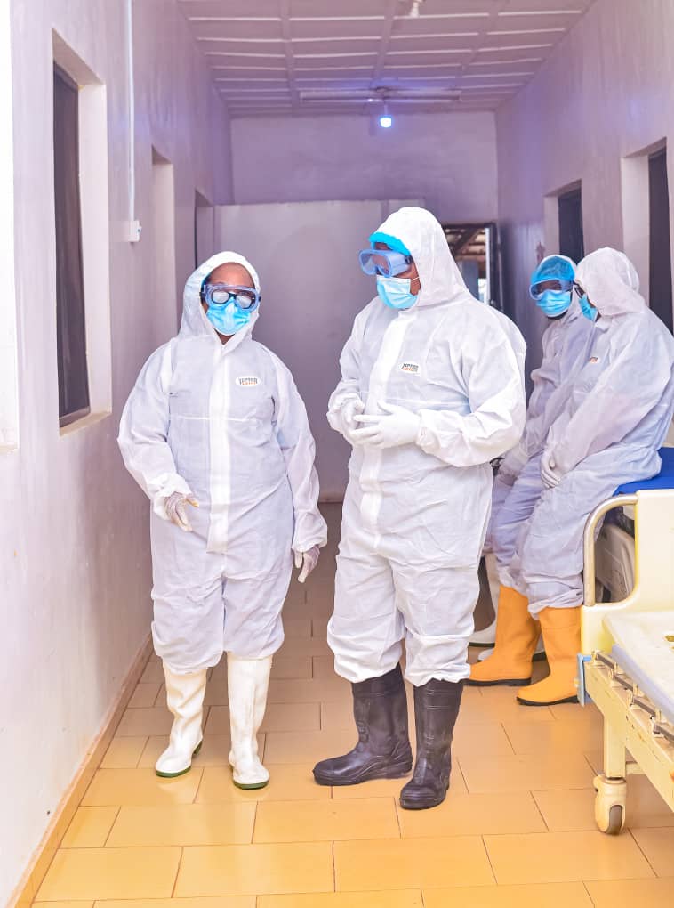 Response team in coverall PPE on the isolation ward corridor