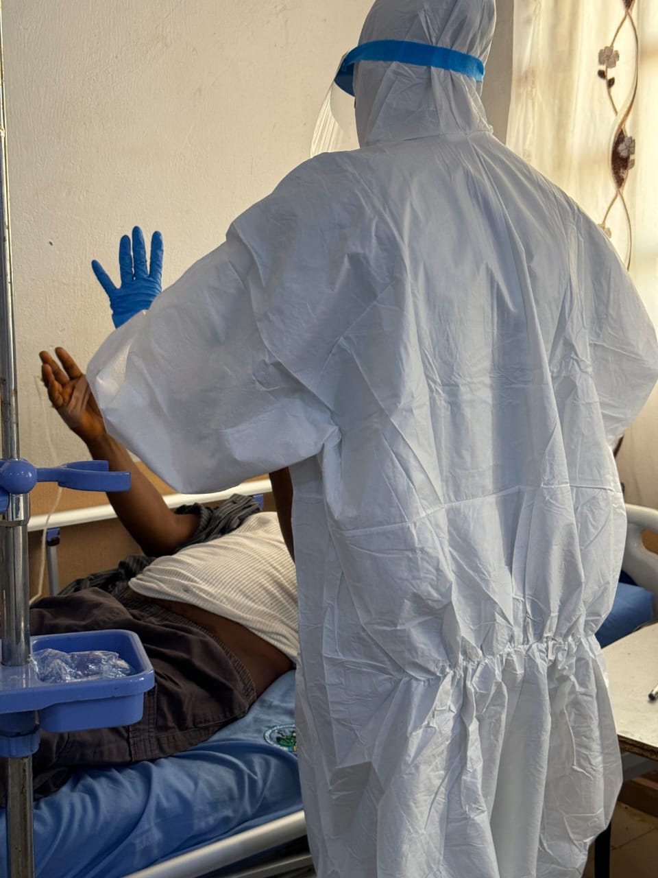 Bedside care of an isolated patient in full PPE